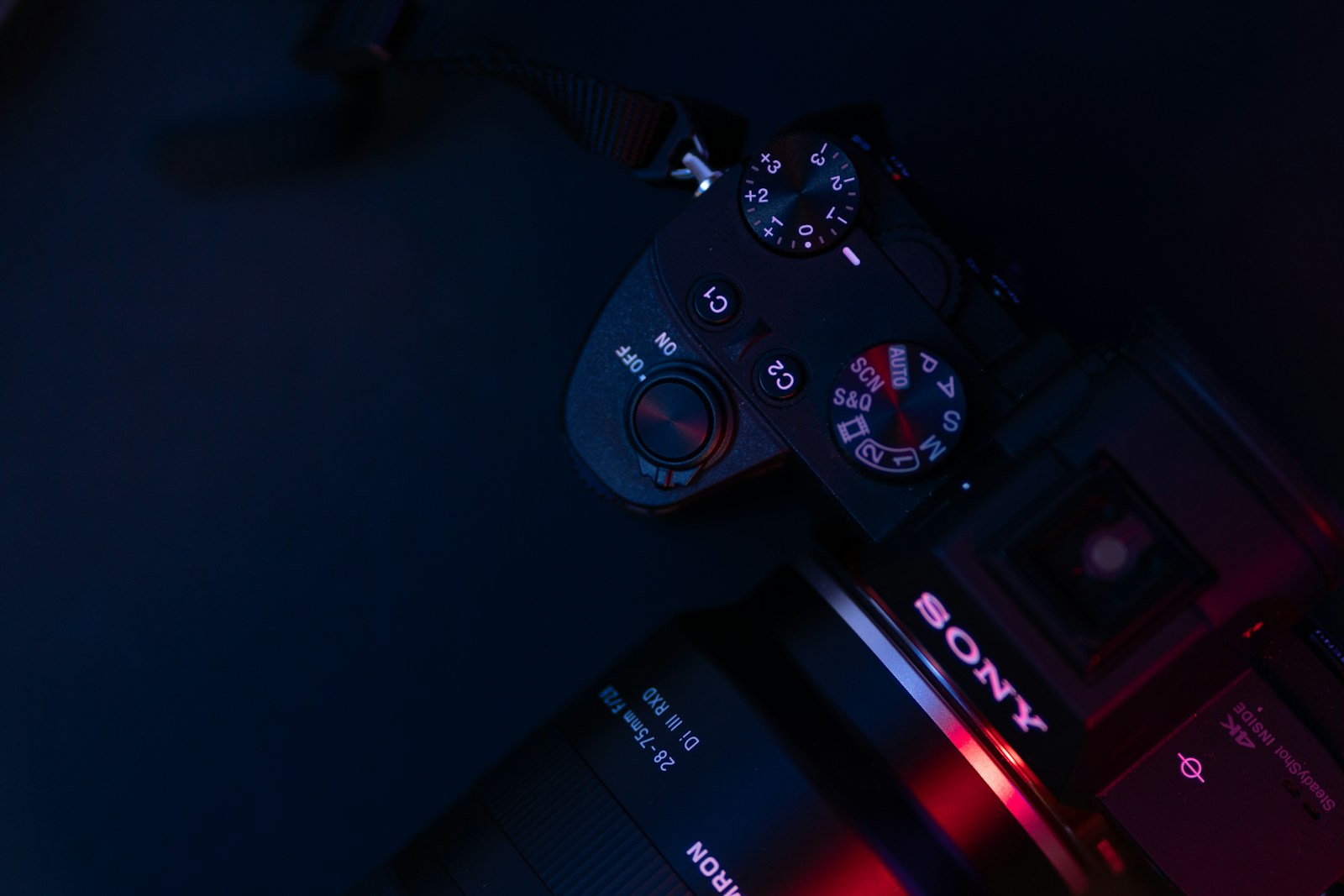 black sony dslr camera on black surface